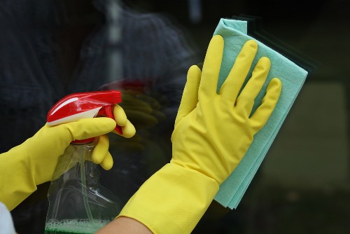Carpet cleaning technician preparing safe equipment for a W11 property