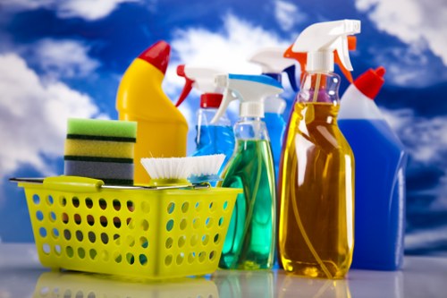Kitchen surfaces being cleaned during domestic cleaning in W11